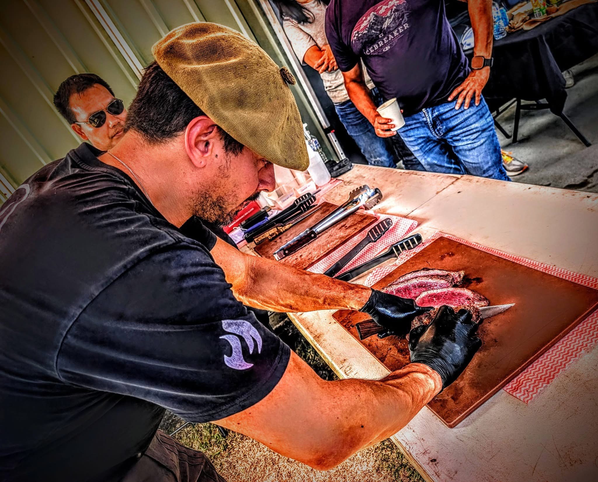 Givago carving the masterclass feast for students